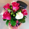 A bouquet of roses in a black vase.
