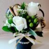 A bouquet of flowers in a blue vase.