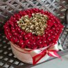 A large bouquet of roses in a hat box.