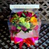 A box of flowers with a bow on top