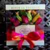 A box of flowers with a bow on top