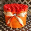 A large orange box with red roses in it.